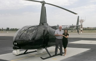 Robinson's Monica Campos delivers R66 Turbine Newscopter to SKY Helicopter's Ken Pyatt